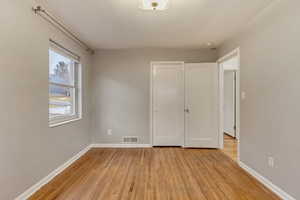 Unfurnished bedroom featuring light hardwood / wood-style flooring