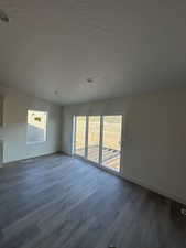 Dining area with LVP flooring and a textured ceiling