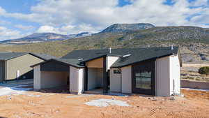 View of front of house with a mountain view