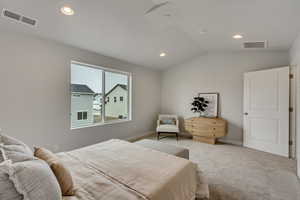 PHOTOS FROM SIMILAR HOME. COLORS & SELECTIONS WILL VARY. Primary Bedroom with lofted ceiling and carpet floors