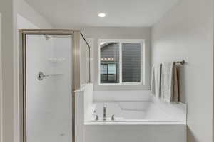 PHOTOS FROM SIMILAR HOME. COLORS & SELECTIONS WILL VARY. Primary Bathroom with shower with separate bathtub