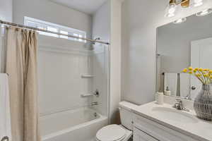 PHOTOS FROM SIMILAR HOME. COLORS & SELECTIONS WILL VARY. Full bathroom with shower / tub combo with curtain, vanity, and toilet