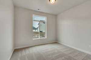 PHOTOS FROM SIMILAR HOME. COLORS & SELECTIONS WILL VARY. View of carpeted guest bedroom (bedroom 5)