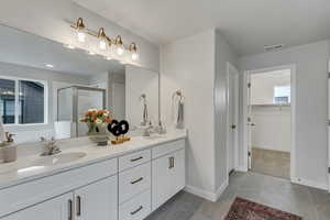 PHOTOS FROM SIMILAR HOME. COLORS & SELECTIONS WILL VARY. Primary Bathroom featuring vanity and walk in shower