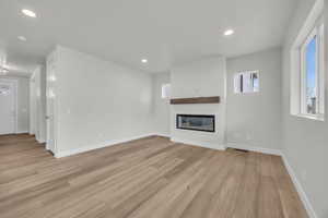 Unfurnished living room featuring light hardwood / wood-style flooring