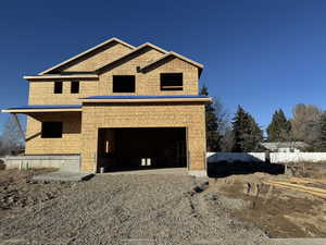 Property under construction with a garage