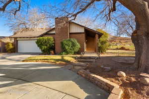 View of front of home featuring a garage