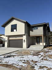 View of front facade featuring a garage