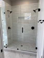 Bathroom featuring a shower with shower door