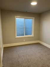 View of carpeted spare room