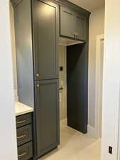 Interior space with tile patterned flooring and vanity