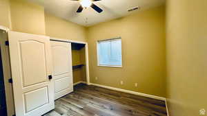 Unfurnished bedroom featuring ceiling fan, hardwood / wood-style floors, and a closet