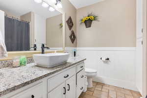 Bathroom with vanity and toilet