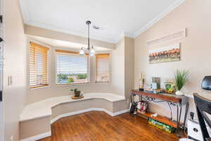 Dining area featuring crown molding and dark hardwood / wood-style floors