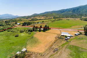 Birds eye view of property featuring a mountain view and a rural view