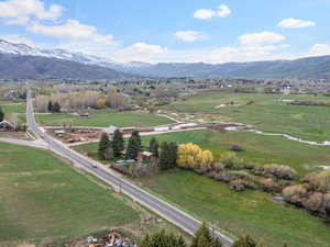 Birds eye view of property with a rural view and a mountain view