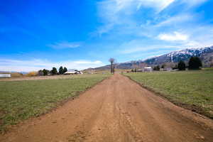 View of road featuring a mountain view and a rural view