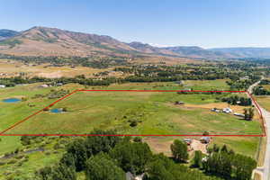 Drone / aerial view featuring a rural view and a mountain view