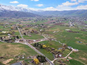 Birds eye view of property with a mountain view and a rural view