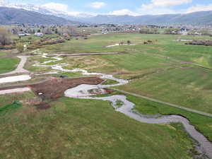 Birds eye view of property with a rural view and a mountain view