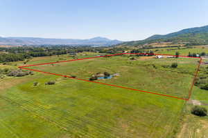 Drone / aerial view featuring a mountain view and a rural view