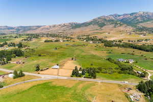 Birds eye view of property with a mountain view and a rural view