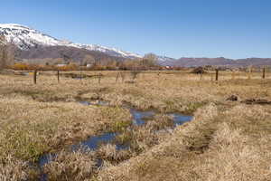 Property view of mountains with a rural view