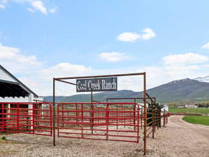 Exterior space featuring a mountain view, a rural view, and an outdoor structure