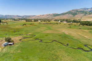 Drone / aerial view with a mountain view and a rural view