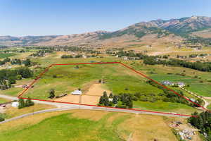 Birds eye view of property featuring a mountain view and a rural view