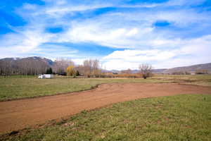 View of yard with a mountain view and a rural view