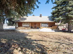 View of front of property with a front lawn