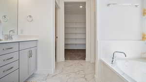 Bathroom with vanity and a bathtub