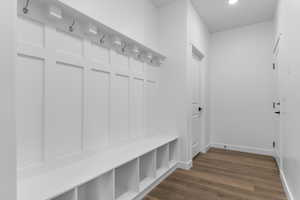 Mudroom featuring dark wood-type flooring