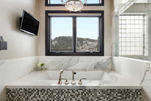 Bathroom with a relaxing tiled tub