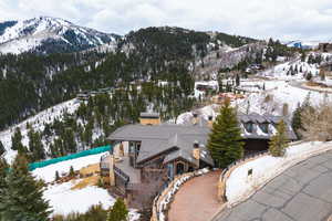 Snowy aerial view featuring a mountain view