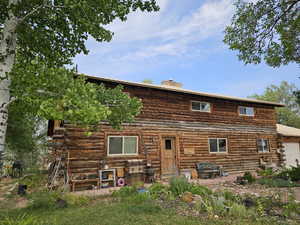 Rear view of property featuring a garage