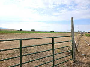 View of gate with a rural view - farm land wheel lines and water!