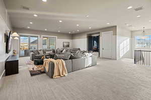 Living room featuring light colored carpet