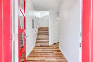 Entrance foyer with light hardwood / wood-style flooring