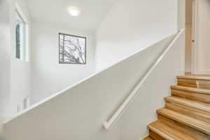 Staircase with vaulted ceiling