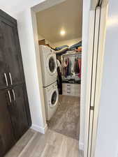 Walk in closet with separate washer and dryer