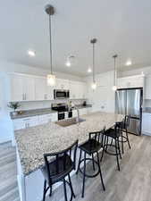 Open Kitchen with Granite Countertops and bar