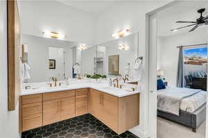 Bathroom with ceiling fan and vanity