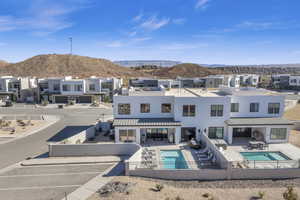 View of swimming pool with a patio and a mountain view