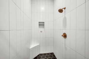 Bathroom with tiled shower