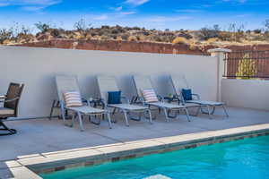 View of swimming pool with a patio area