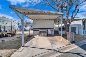 View of patio / terrace featuring a carport