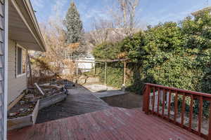 Wooden terrace featuring a fire pit