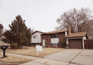 View of front facade featuring a garage